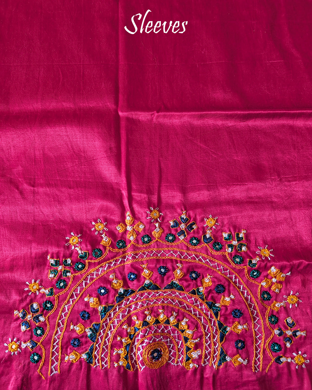 Sleeve embroidery detail on rani pink Bavadiya handwork blouse fabric