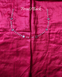 Back view of rani pink Mashru silk blouse piece highlighting handcrafted mirror embroidery