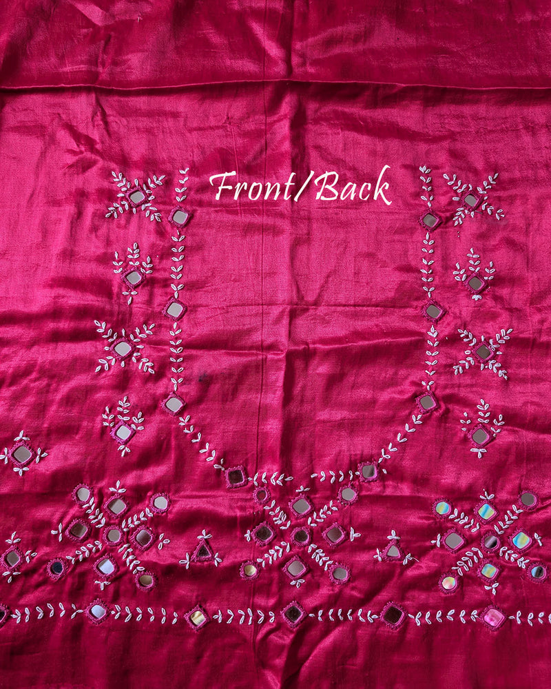 Front view of rani pink Mashru silk blouse piece showcasing intricate Kutch mirror work