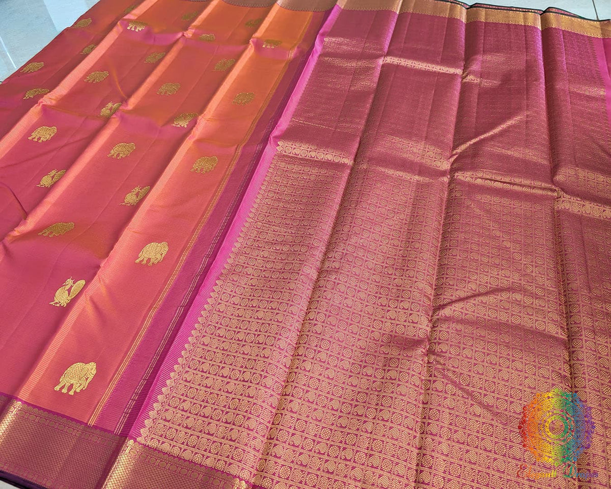 Magenta orange shot Kanjivaram silk saree pallu view with traditional zari work