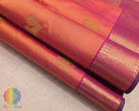 Close up of magenta orange shot Kanjivaram silk saree showing silk weave and zari detail