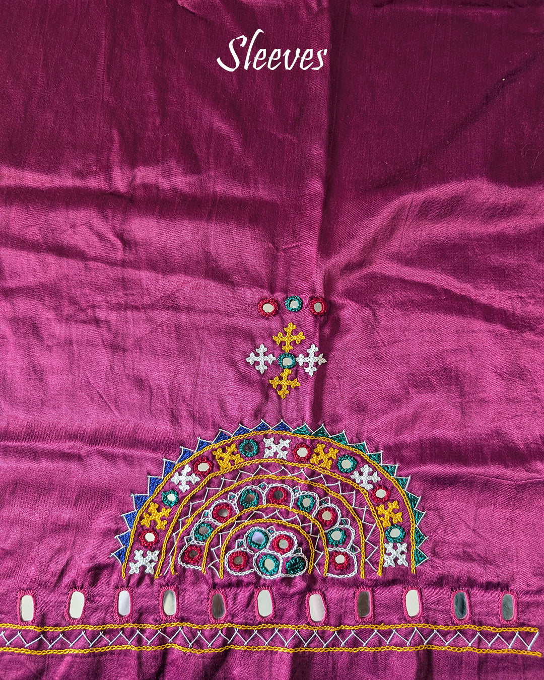 Sleeve embroidery detail on magenta Bavadiya kutch handwork blouse fabric