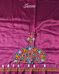 Sleeve embroidery detail on magenta Bavadiya kutch handwork blouse fabric