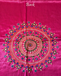 Close-up of large circular Bavadiya handwork motif on Magenta Mashru Silk Blouse Piece back