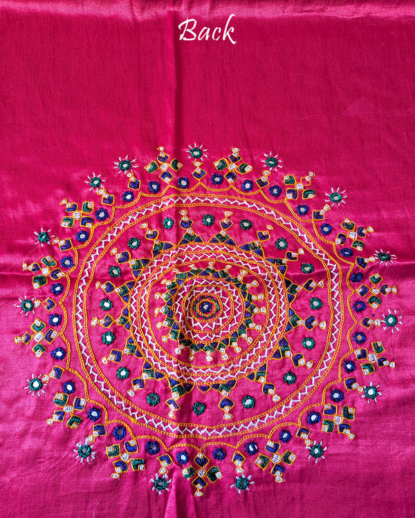 Close-up of large circular Bavadiya handwork motif on Magenta Mashru Silk Blouse Piece back