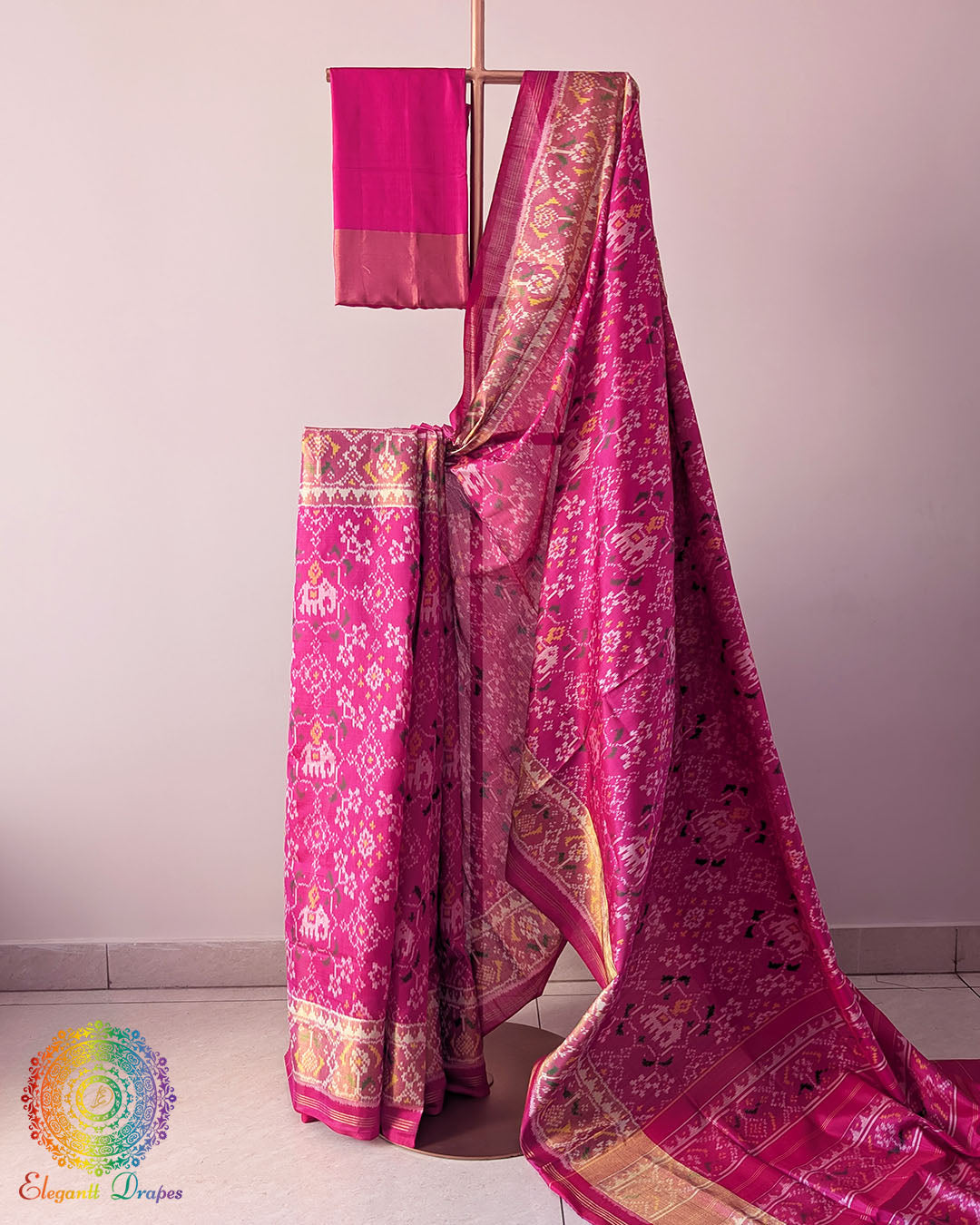 Magenta Pink Handwoven Mulberry Silk Rajkot Patola Saree – Full Drape View showcasing the vibrant magenta pink colour, traditional Rajkot Patola patterns and graceful drape of the handwoven mulberry silk saree, highlighting its rich colour and elegant ethnic appeal.