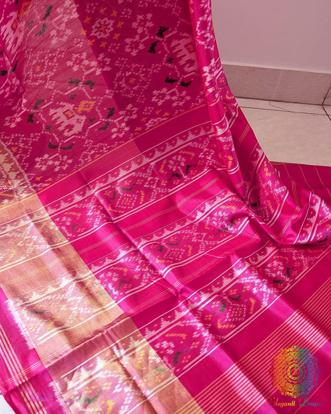 Magenta Pink Rajkot Patola Silk Saree – Palla Close-Up highlighting the intricate traditional motifs and geometric patterns woven across the palla, showcasing the detailed craftsmanship and rich texture of the magenta pink mulberry silk.
