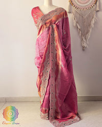 Magenta Pink Soft Tissue Silk saree with self-woven wave pattern and Cutdana, pearl, and zardozi handwork