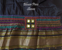 Blouse sleeve detail showing embroidery and finishing