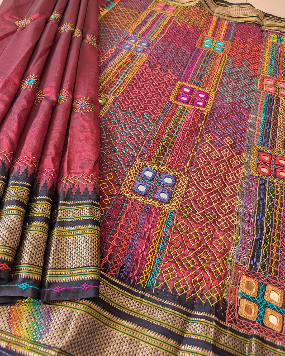 Maroon Ilkal silk saree body close up highlighting embroidery detail