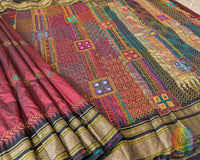 Pleats detail of maroon silk saree showing structured drape