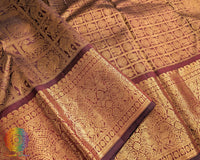 Bridal maroon Kanjivaram silk saree traditional weave close up