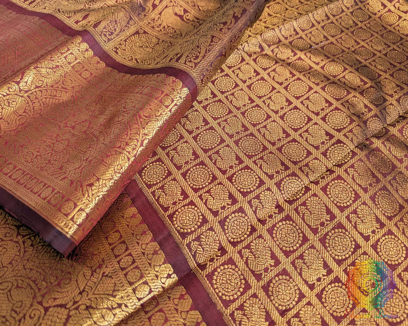 Maroon handwoven Kanjivaram silk saree zari border detail