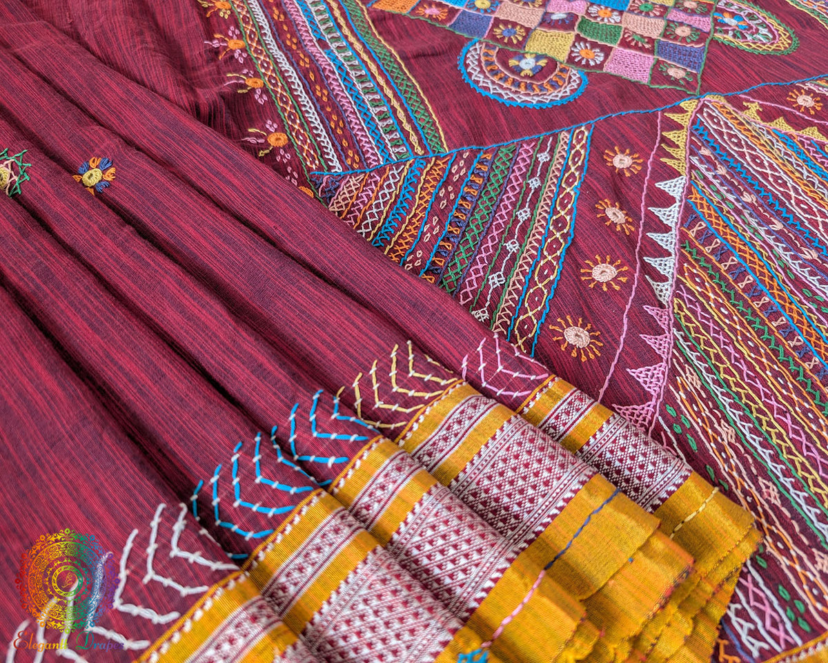 Maroon Ilkal cotton saree with Lambani handwork embroidery close up view