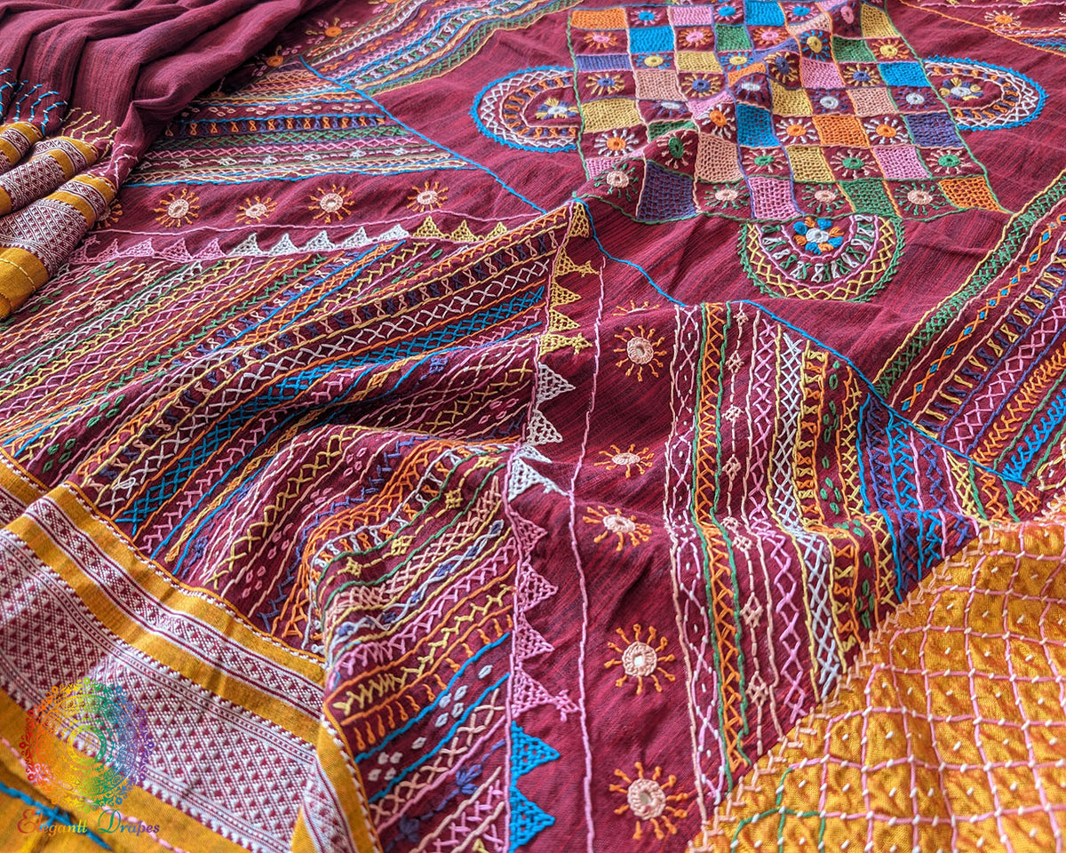 Maroon Ilkal cotton saree with Lambani handwork border floor view