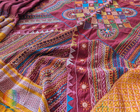 Maroon Ilkal cotton saree with Lambani handwork border floor view