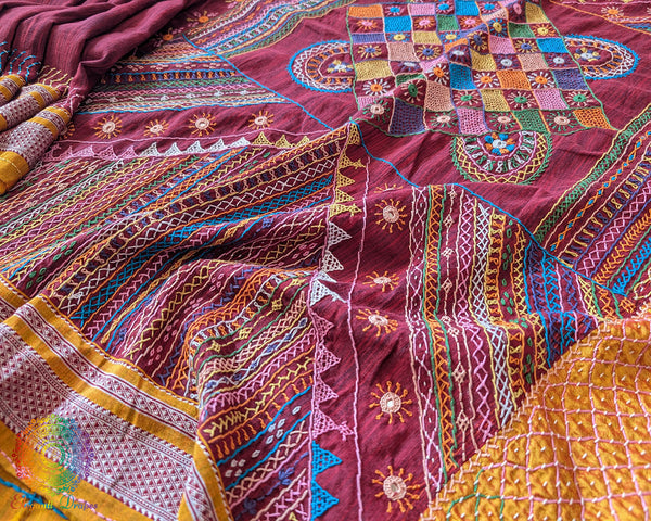 Maroon Ilkal cotton saree with Lambani handwork border floor view