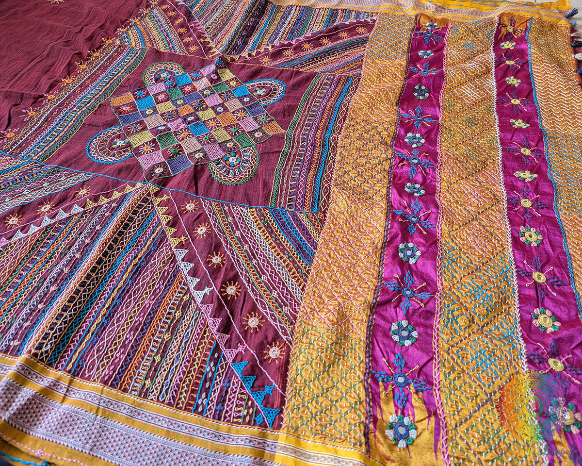 Maroon Ilkal cotton saree with Lambani handwork fabric texture view