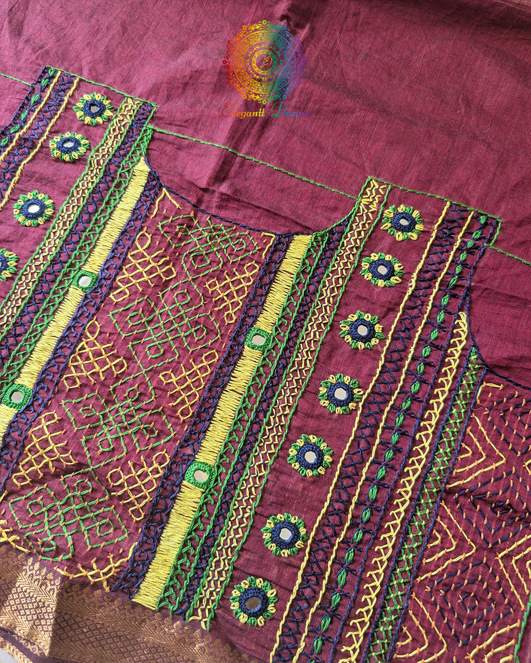 Close-up of Lambani hand embroidery on the back of Maroon Mangalgiri Cotton Blouse Piece