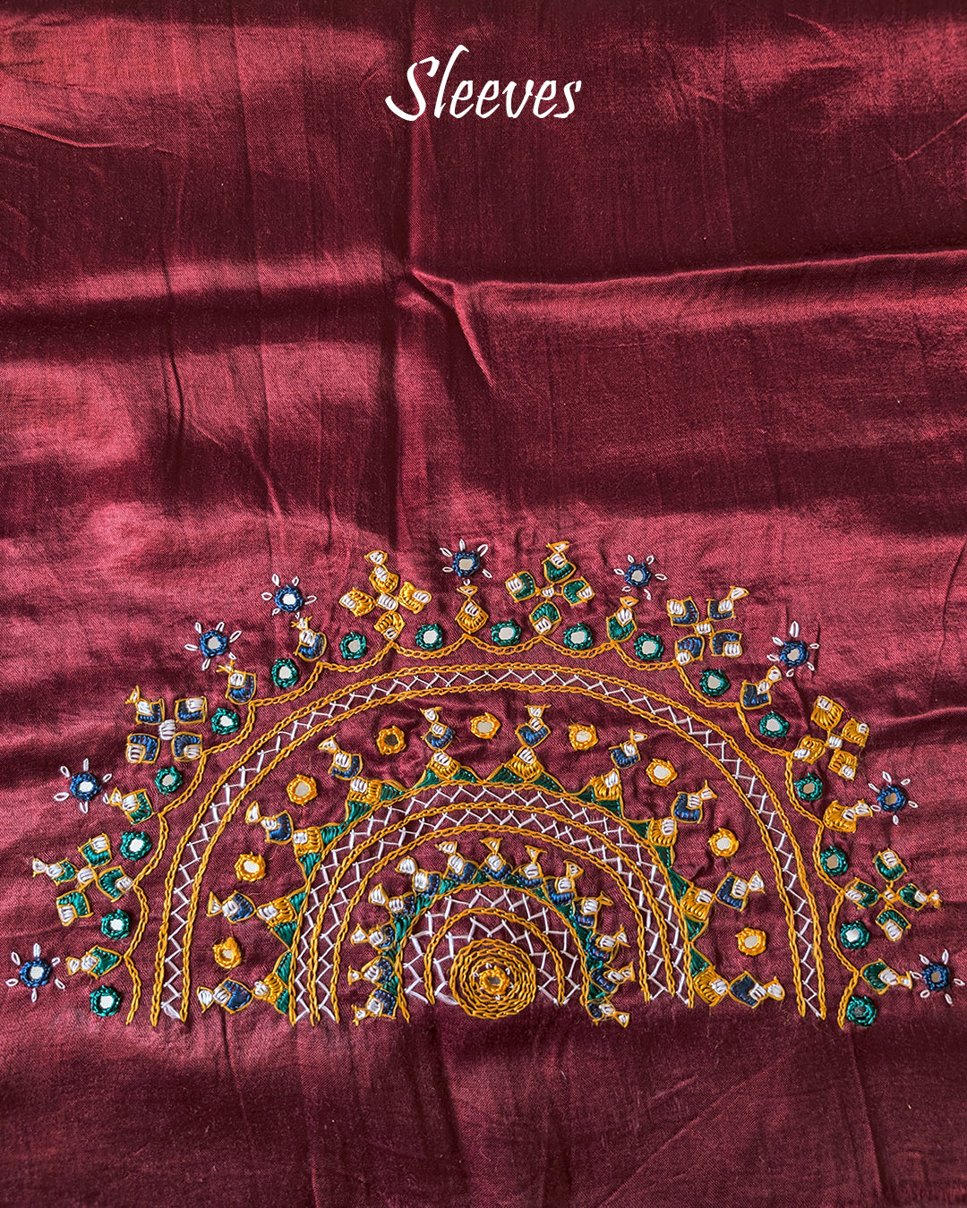 Sleeve embroidery detail on maroon Bavadiya handwork blouse fabric