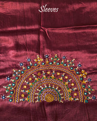 Sleeve embroidery detail on maroon Bavadiya handwork blouse fabric