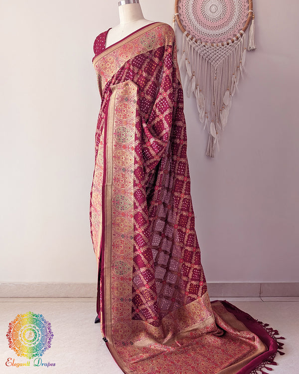 Side angle view of maroon bandhani saree highlighting graceful palla fall
