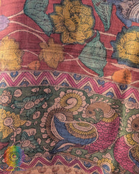 Close-up of authentic hand-painted Kalamkari artwork highlighting the rich texture and natural sheen of Pure Tussar Silk