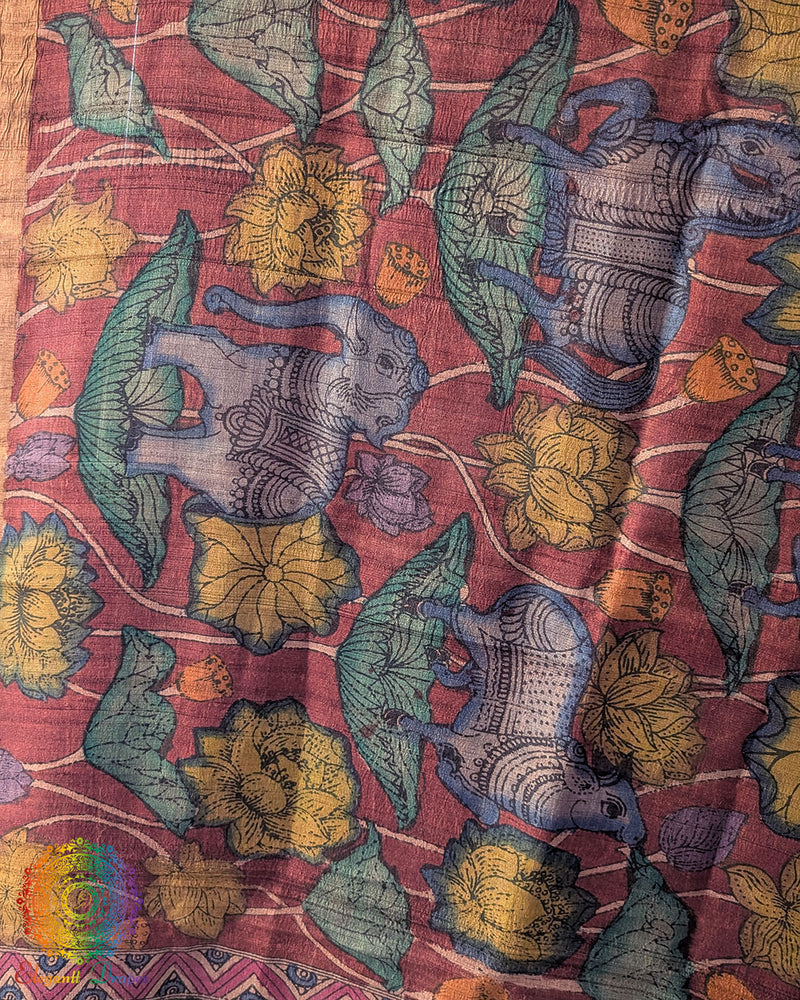 Close-up of intricate hand-painted Kalamkari motifs on luxurious Maroon Pure Tussar Silk dupatta