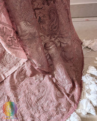 Mauve cotton saree showcasing intricate paisley and floral threadwork motifs