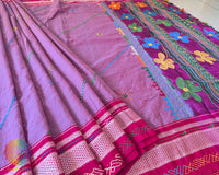 Close-up of Lambani embroidered bels and floral motifs on the mauve cotton saree