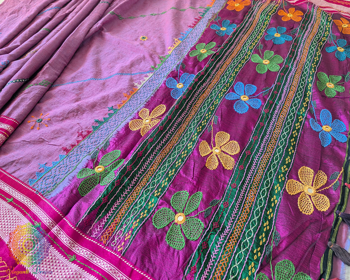 Close-up of intricate multicolored Lambani hand embroidery on the richly embellished palla