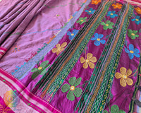 Close-up of intricate multicolored Lambani hand embroidery on the richly embellished palla