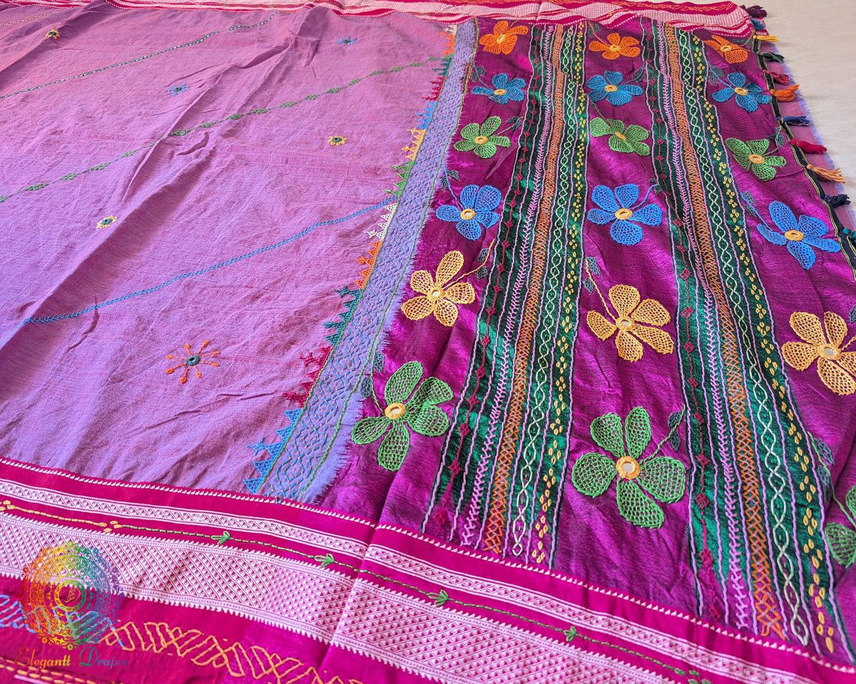 Mauve cotton saree highlighting decorative Lambani embroidered bels