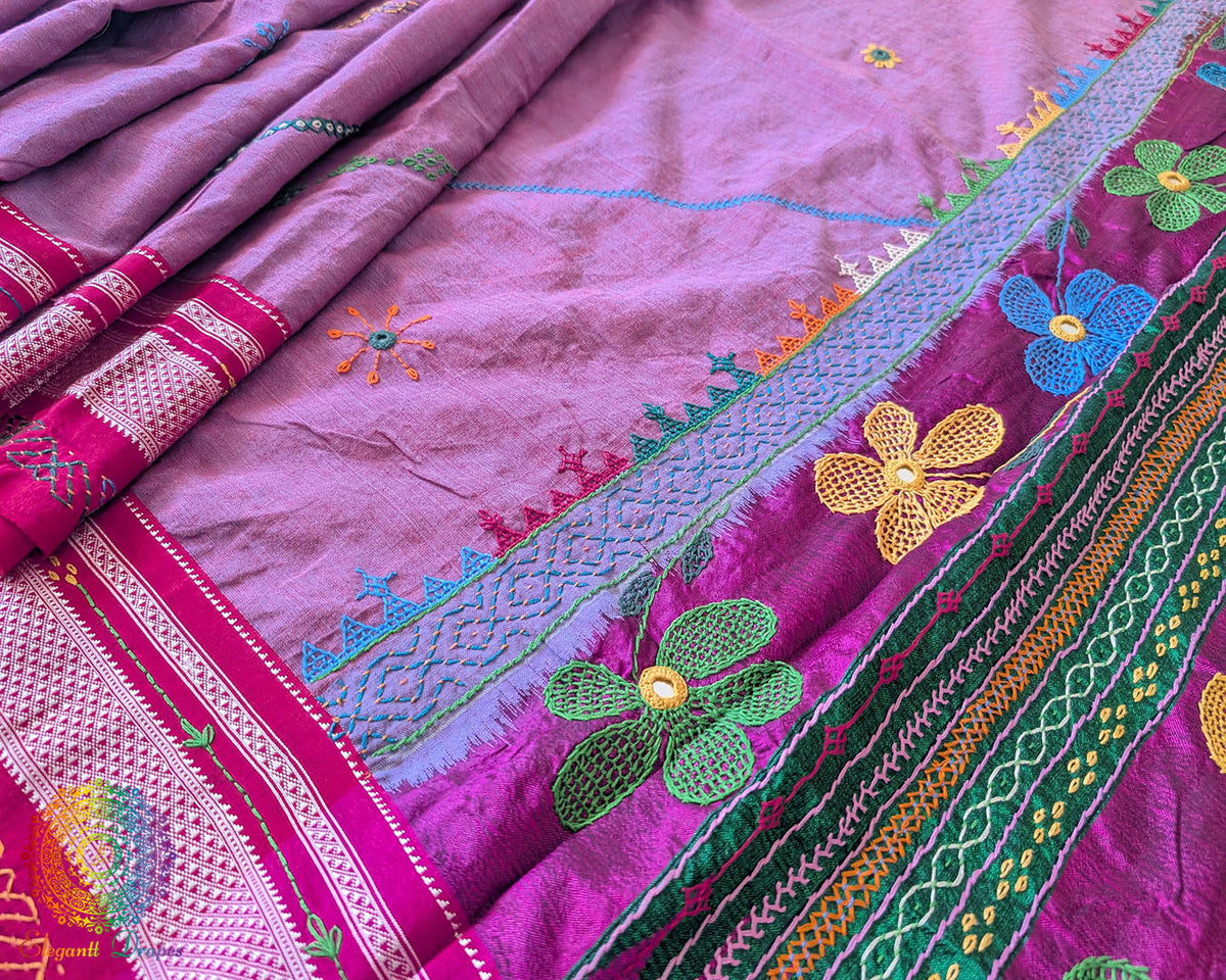Detailed view of handcrafted Lambani embroidery on the mauve cotton saree