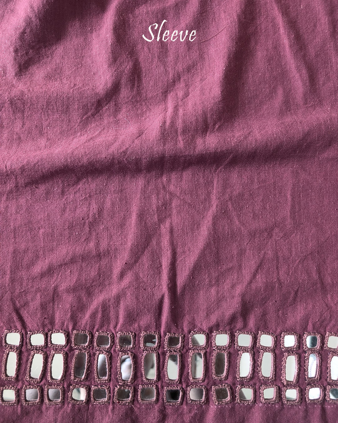 Sleeve detail of the Mauve Kala Cotton Kutch Mirror Handwork blouse piece, highlighting the real mirror embellishments, detailed threadwork and elegant mauve cotton fabric.