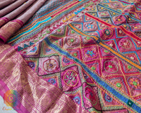 Mauve pure Kanjivaram silk saree with Lambani handwork embroidery close up 