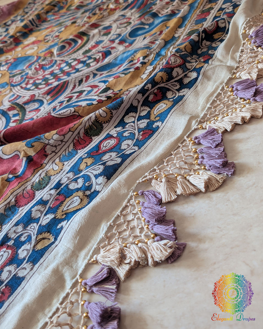 Close-up of the Kalamkari pallu with heavy tassels on the Mauve Bandhani Kalamkari Muga Silk Saree