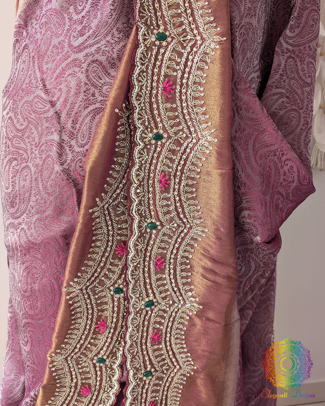 Close-up of the self-woven wave pattern, embroidered floral butis, and lustrous Soft Tissue Silk texture