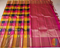 Full Kanjivaram silk saree laid open showing multi check pattern and zari weaving