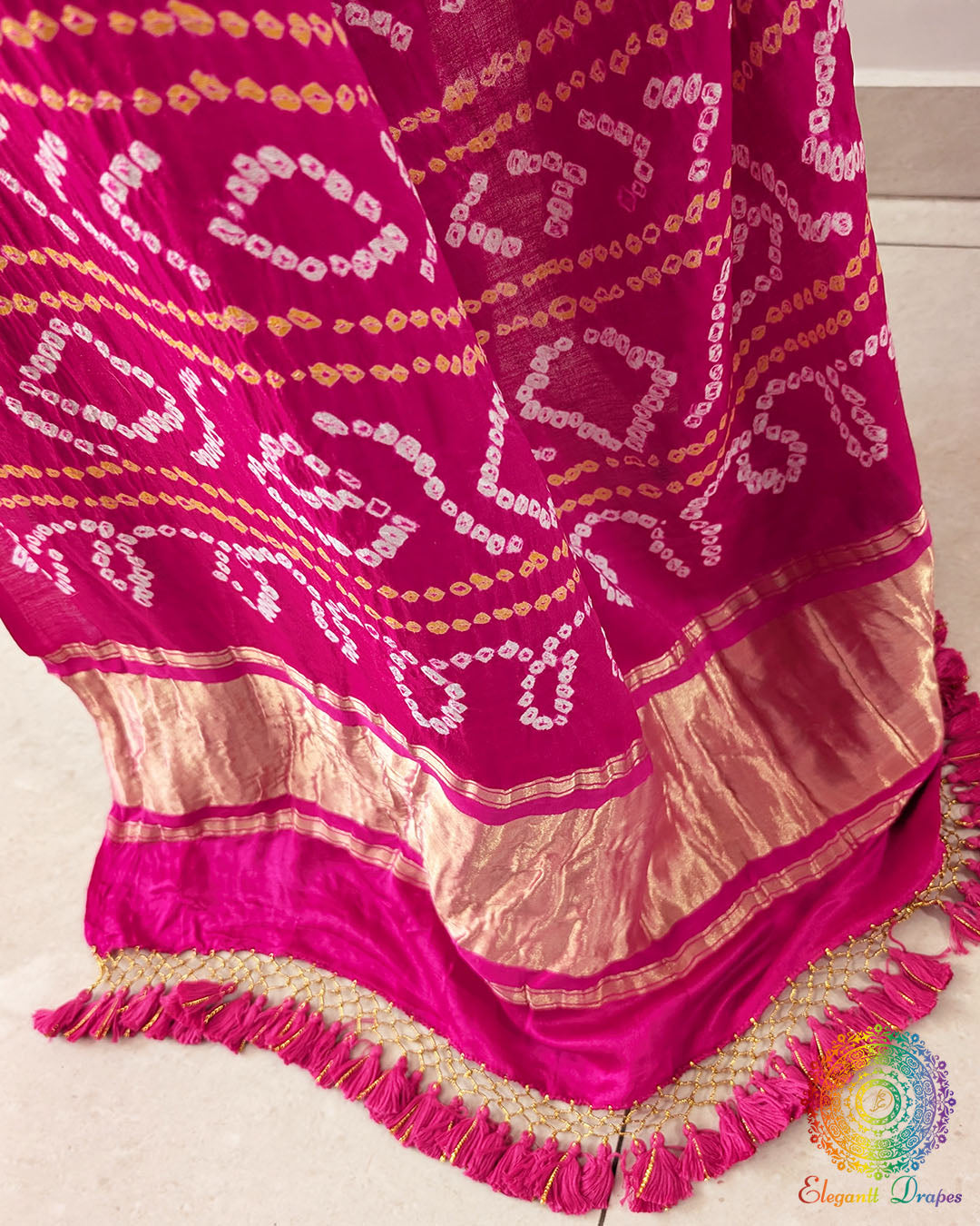 Rani Pink Gharchola Pallu with Bandhani detailing on Off White Gajji Silk Saree