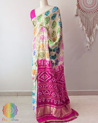 Rani Pink Gharchola Pallu with Bandhani detailing on Off White Gajji Silk Saree