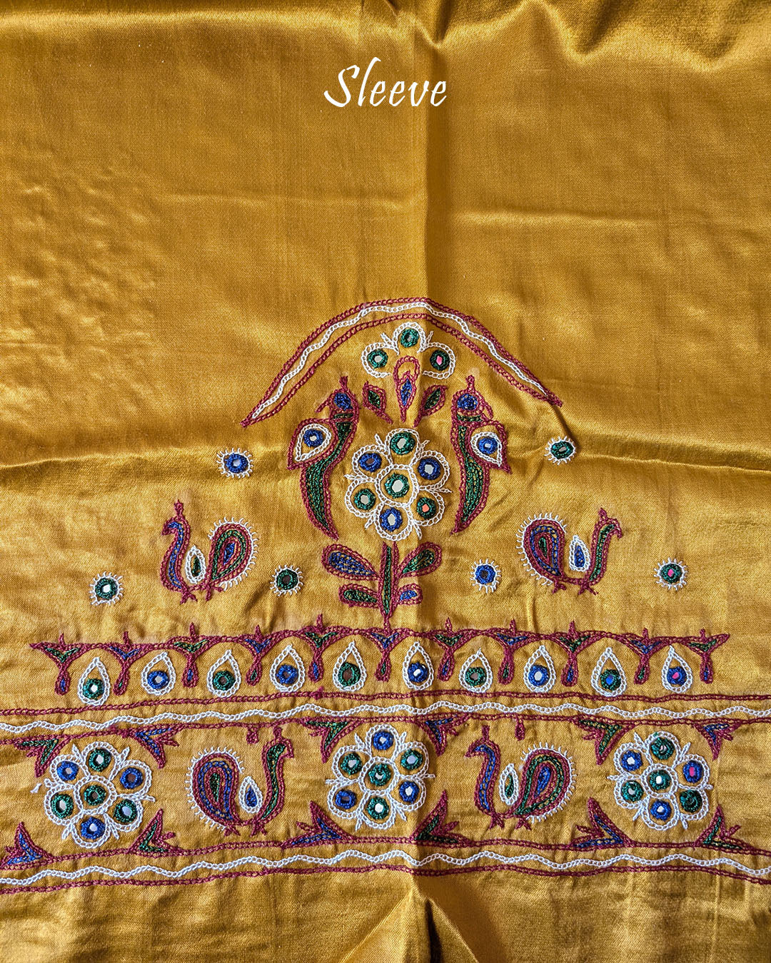 Close-up of Kutch embroidery on sleeve of Mustard Golden Mashru Silk Blouse Piece