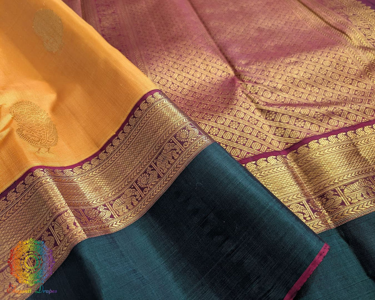 Close-up of Mustard handwoven Kanjivaram silk saree green border with 2 gram zari