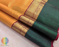 Close up of mustard Kanjivaram silk saree showing pure silk weave and zari detail