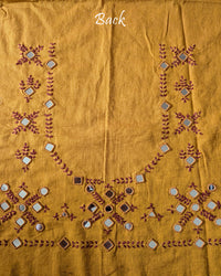 Back view of the Mustard Kala Cotton Kutch Mirror Handwork blouse piece, showcasing detailed Kutch embroidery and real mirrors arranged in a decorative handcrafted design.
