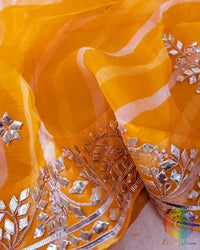 Mustard Orange Organza Saree – Detailed Leheria pattern enhanced with carefully handcrafted Kachha Gota embellishment