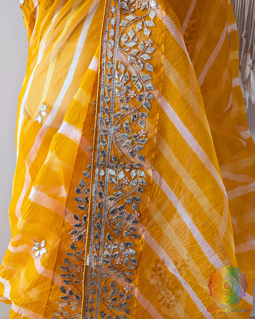 Mustard Orange Organza Saree – Detailed view of handcrafted Kachha Gota embellishment adding traditional shimmer to the Leheria patterned body