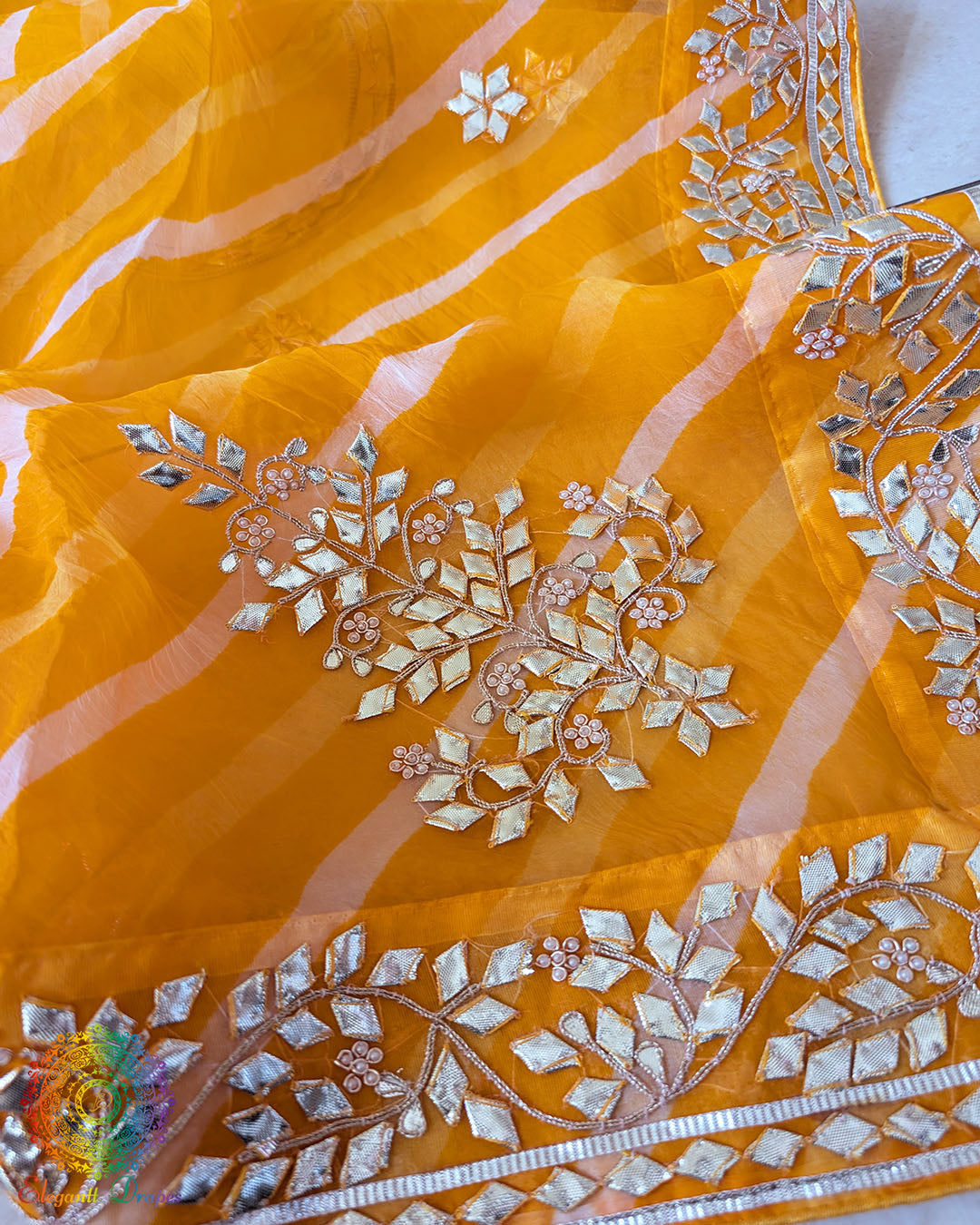 Mustard Orange Organza Leheria Saree – Detailed body view showcasing the warm mustard orange colour, delicate Organza texture and traditional Gota handwork