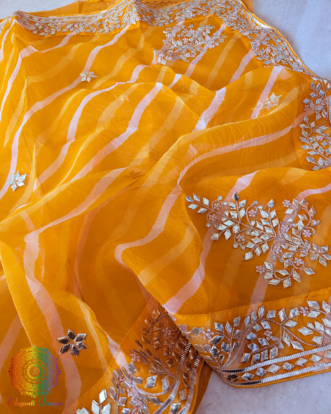 Mustard Orange Organza Leheria Saree – Close view of the intricate Kachha Gota Handwork against the lightweight Organza fabric