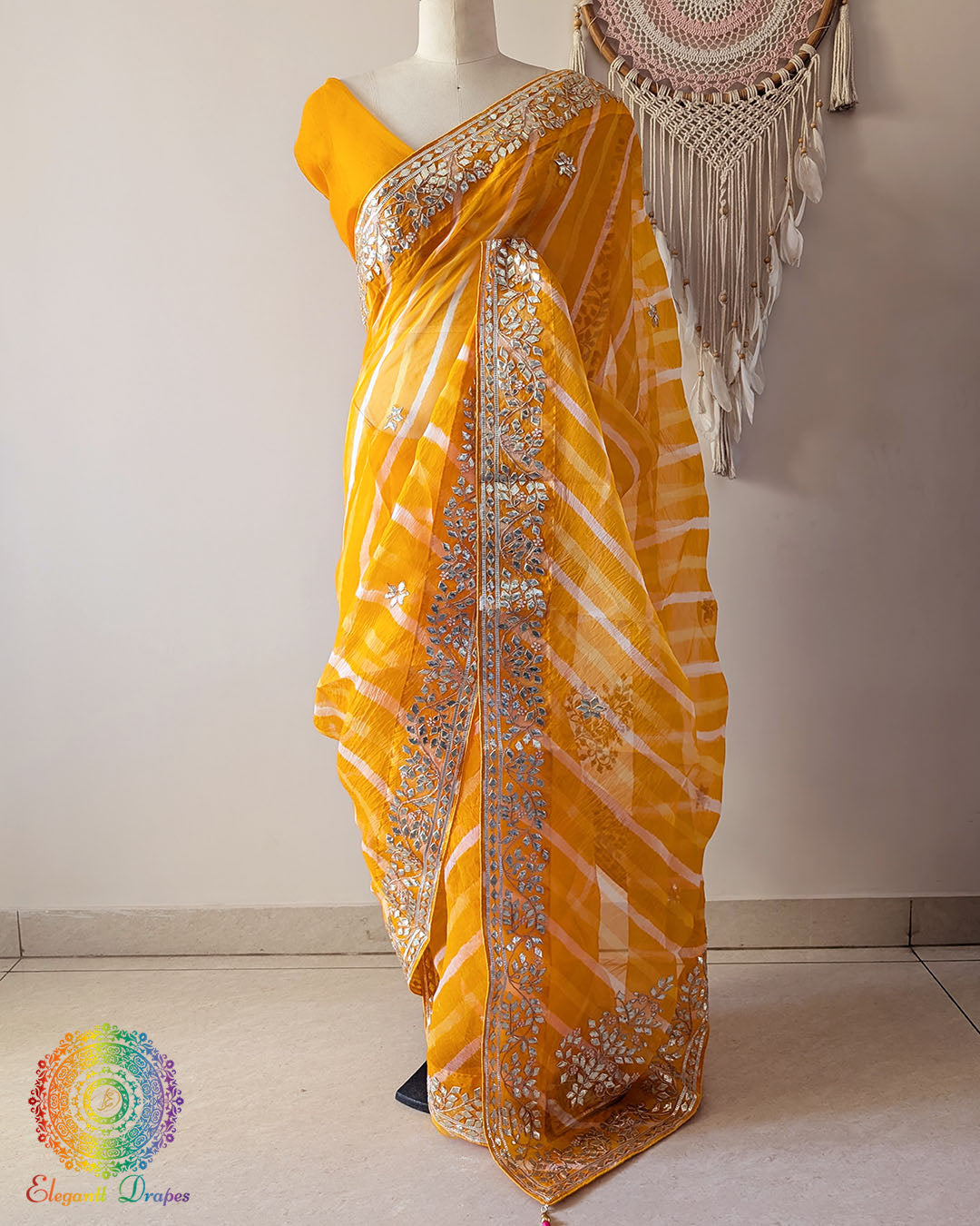 Mustard Orange Organza Leheria Saree with Kachha Gota Handwork – Front Drape showcasing the vibrant mustard orange shade, graceful Leheria pattern and intricate handcrafted Gota detailing